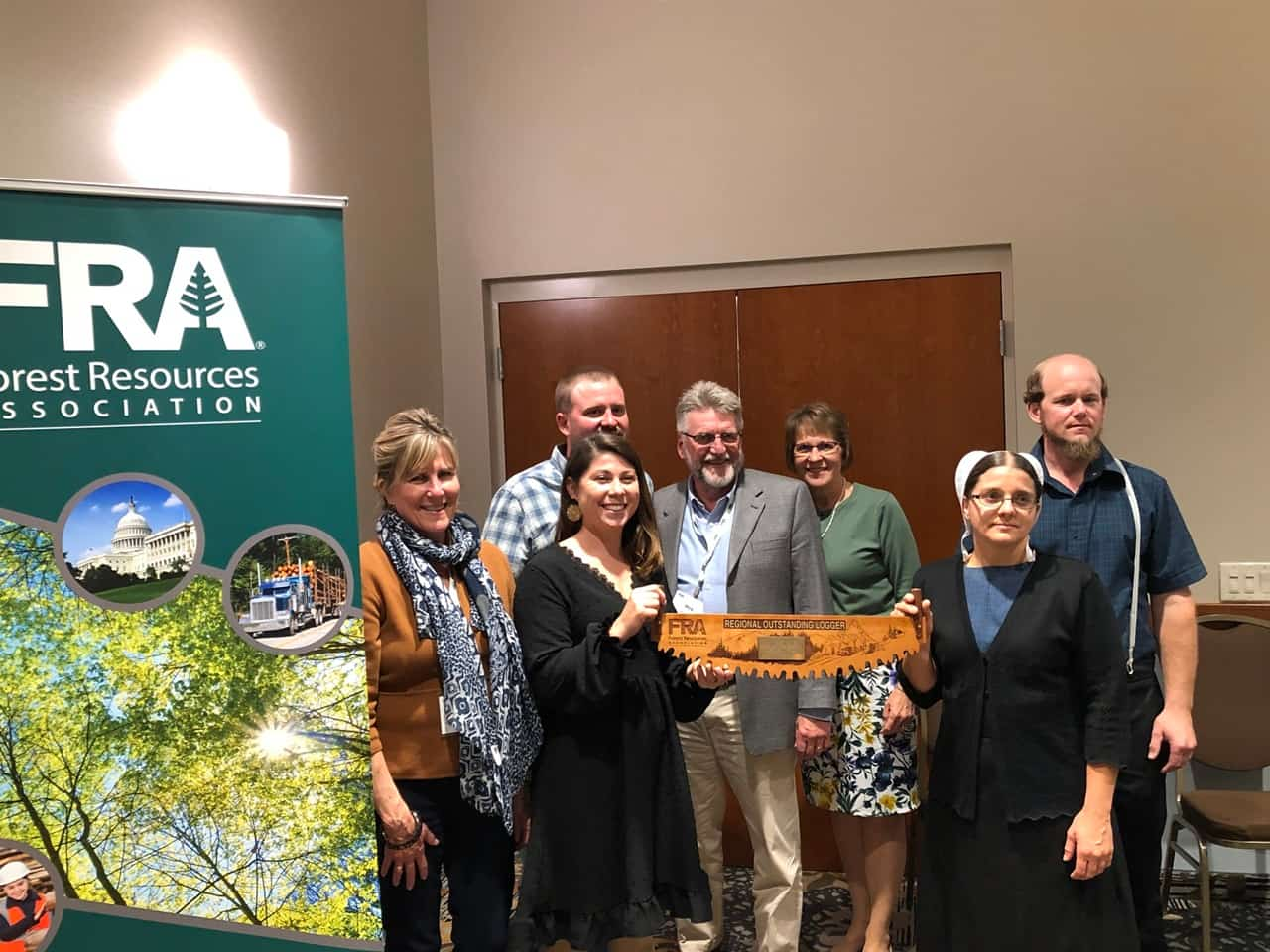 members of AM Logging accepting the Outstanding Logger Award from the FRA