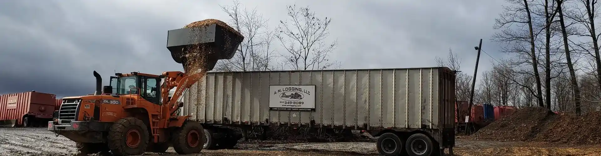 A.M. Logging truck being loaded with mulch