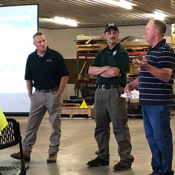 three men leading wildfire prevention training